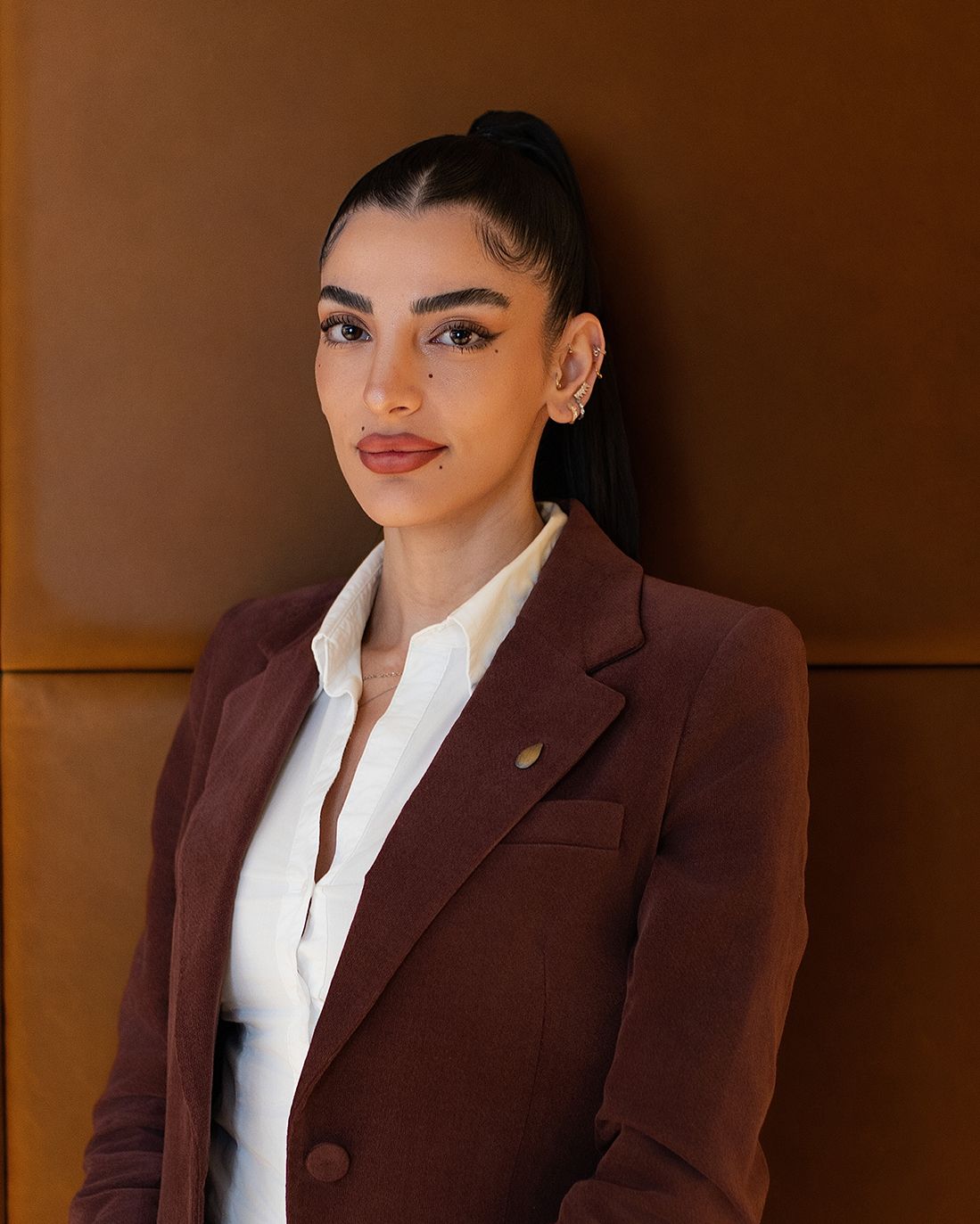 Eden Bettan's Headshot With A Dark Blazer